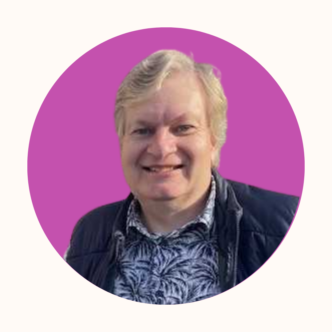 Image of John Clements smiling on a purple background. Trustee